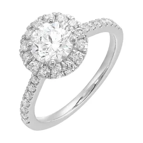 Dazzle with classic round solitaire framed by a sparkling halo. The studded shank adds a touch of classic look, making this ring a timeless symbol of elegance.
